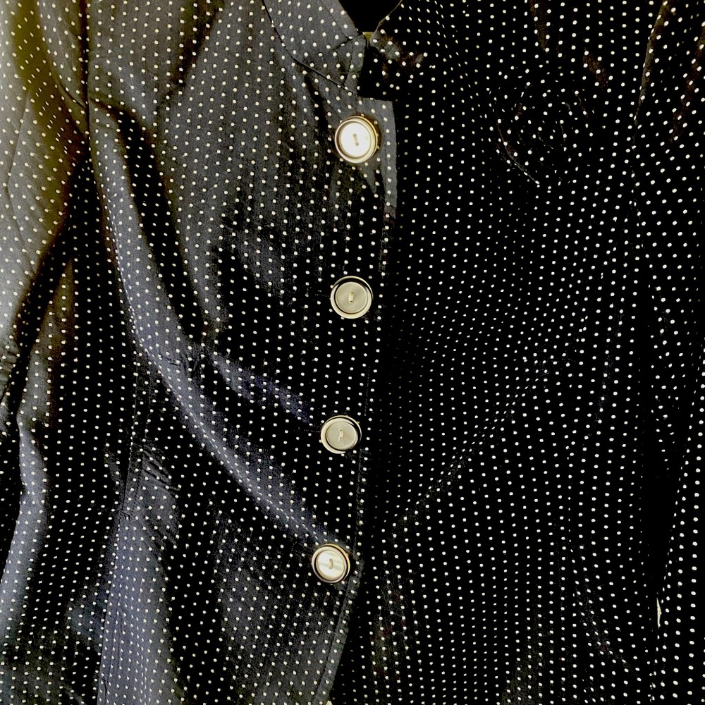 Navy, blue and white polkadotted jacket with a navy blue skirt